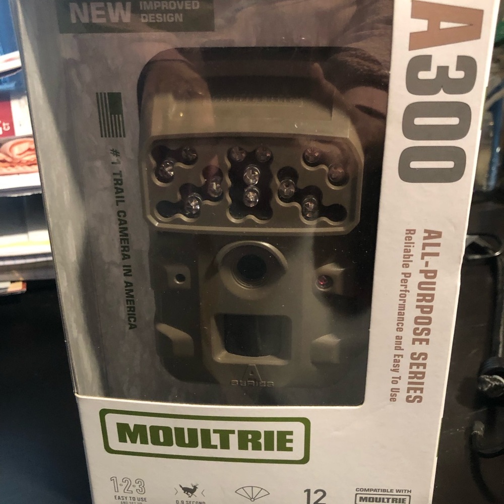 Moultrie game/trail camera. Comes with SD card and is battery operated.
